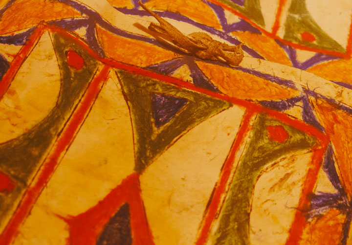 Close-up colorful geometric crayon drawing with triangles